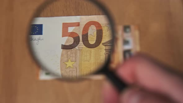 Fifty Euro Under Magnifying Glass