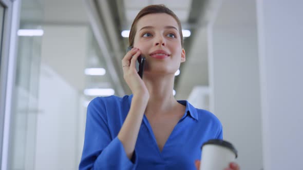 Beautiful Girl Talking Phone in Office