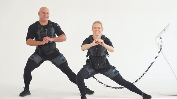 Young Couple Performing Lunge Exercise