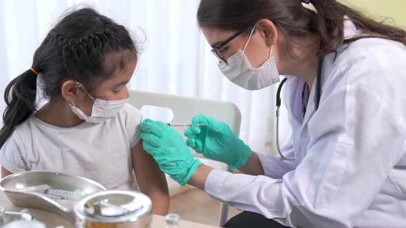 School Girl Visits Skillful Doctor at Hospital for Vaccination