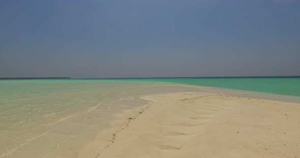 Luxury birds eye abstract shot of a paradise sunny white sand beach and turquoise sea background in 