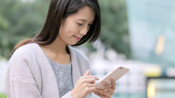 Asian Woman use of cellphone 