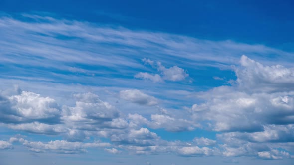 Timelapse of Layered Cumulus Clouds Moving in the Blue Sky