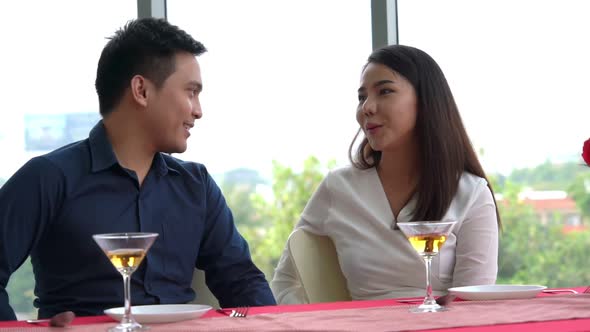 Happy Romantic Couple Eating Lunch at Restaurant