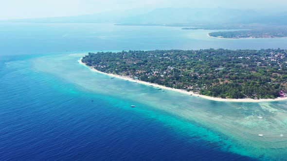 Beautiful above clean view of a sunshine white sandy paradise beach and aqua blue water background i