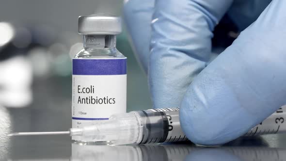 E.coli antibiotics vial in medial lab with syringe