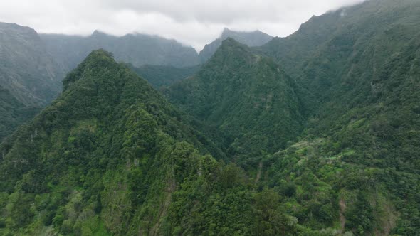 Epic untouched mountainous terrain with lush jungle, central Madeira; aerial