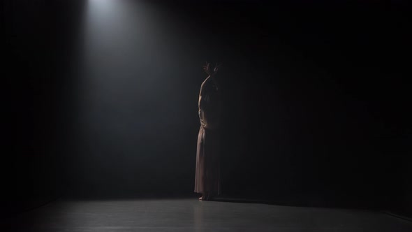 Motion of a Skillful Maiden Dancing Contemporary in Dark Studio