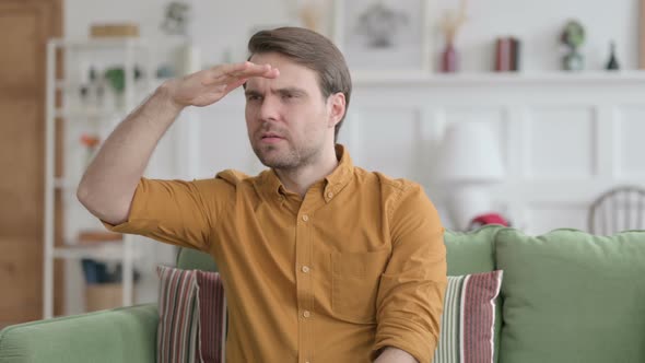 Portrait of Young Man Looking Around Searching