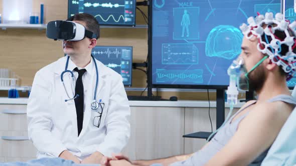 Doctor in a Neuroscience Centre Wearing a Virtual Reality Goggles