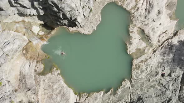 aerial drone headshot of Albanian canyon "Syri i ciklopit". Albanian nature stock videos. Tourists s