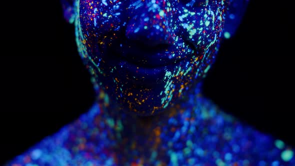 Closeup of Lips Man Painted with Various Fluorescent Body Paints Front View