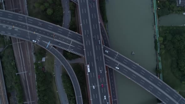 Aerial Drone View of Highway Multilevel Junction Road with Moving Cars at Sunset