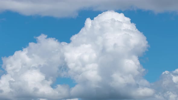 Fluffy White Clouds Moving Fast in Time-lapse. Daylight, Cloudy Heaven Background. Timelapse of