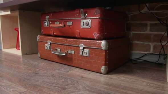 Two Old Retro Suitcases Lie on the Floor