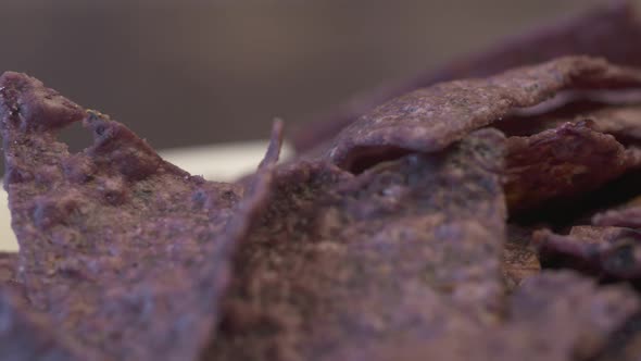 Delicious close up on a bunch of crispy, crunchy, blue nachos.