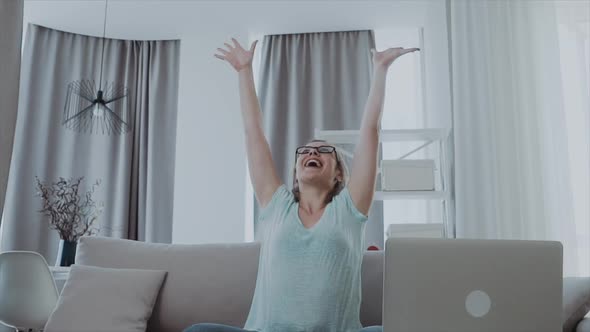 Happy Business Woman Throwing Papers Document in the Air at Home