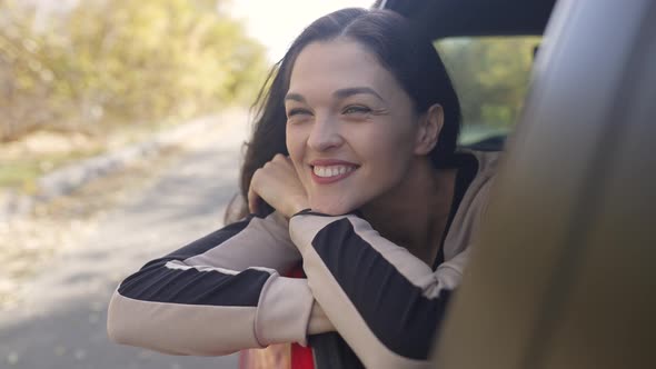 Woman Looks Out From Car