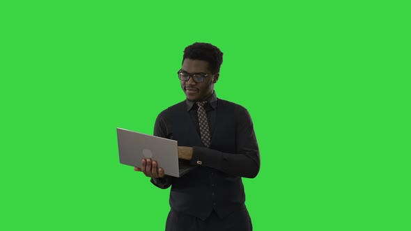 Confident African American Businessman Typing Laptop Looking Camera Smile While Standing Green