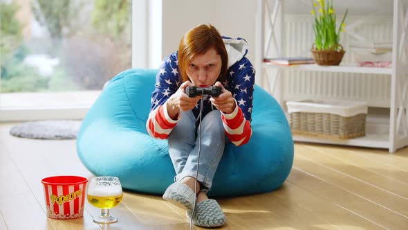 Wide Shot Portrait of Happy Cheerful Mature Woman Gaming Online with Game Controller