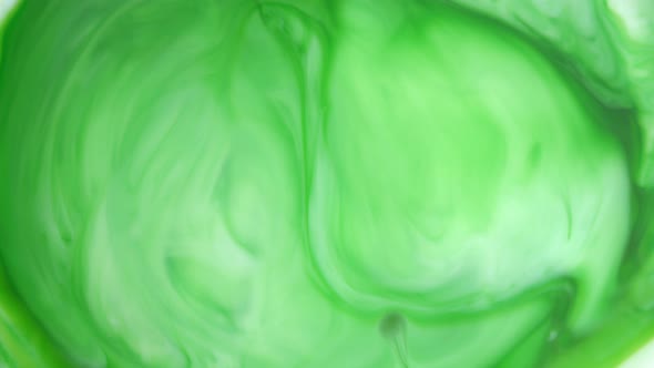  Footage. Ink in Water. Green Ink Reacting in Water Creating Abstract Background.