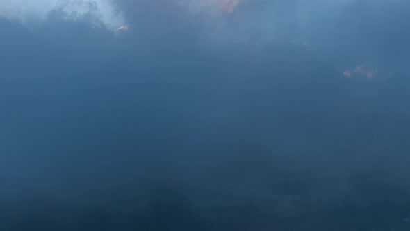 Dramatic Mystical Landscape Rolling Clouds in Mountain Hills Kazbegi Peak with Snow Cap Moving Fog