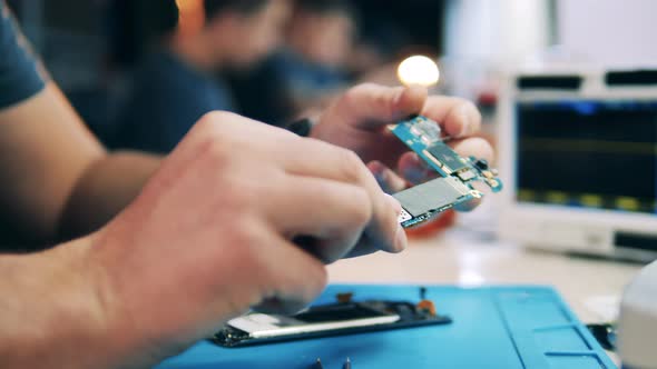 Service Technician Inspecting Gadget's System on Chip