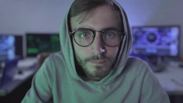 Computer POV, Happy Young Man in Eyeglasses Smiling and Looking at USB Plug on Cable. Satisfied