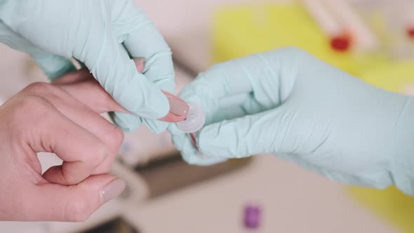 A Healthcare Worker Doing Fingerstick Whole Blood Antibody Test