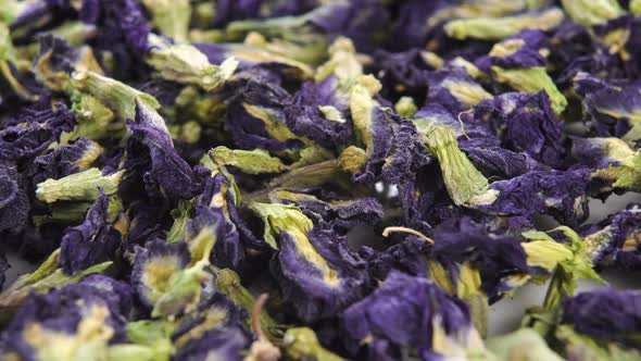 Dry butterfly tea. Blue dried Clitoria ternatea flowers. Macro