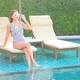 Young asian woman enjoy around outdoor swimming pool for leisure - VideoHive Item for Sale