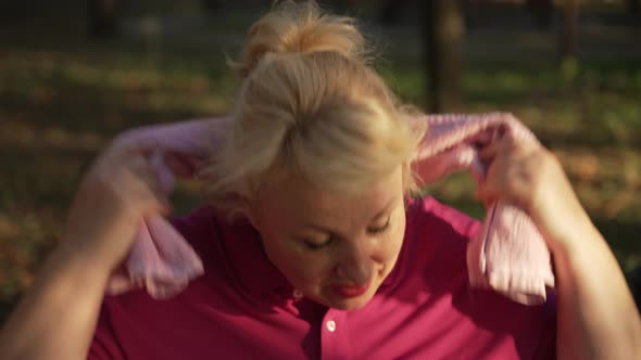 Mature Woman Resting After Running