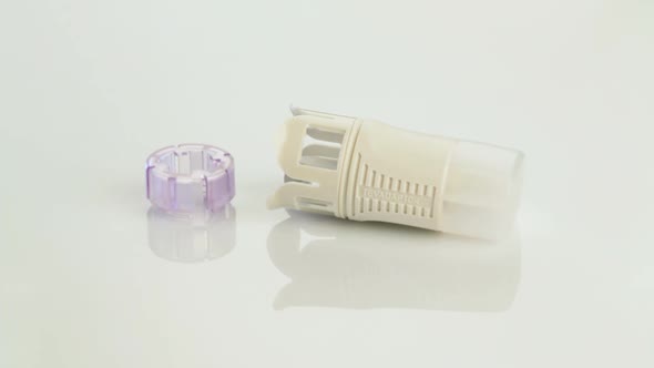 Precision medical plastic parts on white background