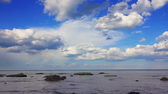 White Fluffy Clouds over the Sea