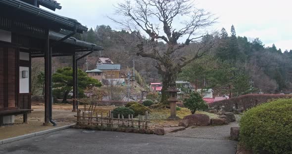 Walking Traditional Japanese Zen Stone Garden at Spring. Rural Cozy House with Beautiful Yard