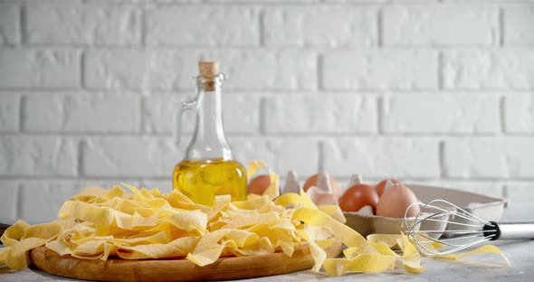 Dry Fettuccine Pasta with Eggs and Oil Rotates Slowly. 