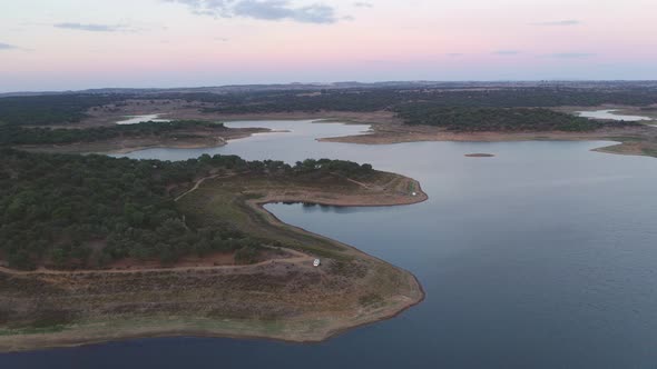 Drone panoramic aerial view of Minutos Dam in Arraiolos Alentejo at sunset, Portugal