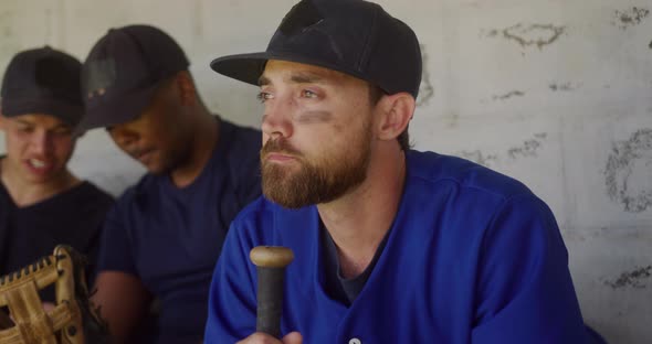 Baseball player looking away in the locker room