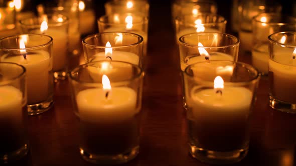 Rows of candles in a church or temple.