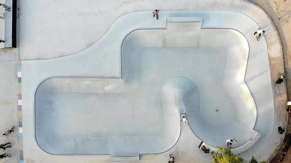 Skate park with men riding bicycles