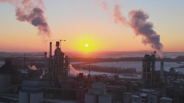 Aerial View of Cement Factory Tower with High Concrete Plant Structure at Industrial Production Area