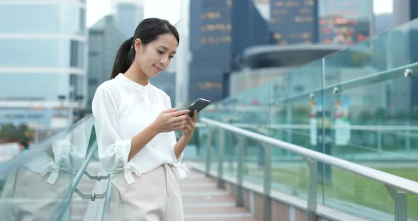 Business Woman Use of Mobile Phone in City