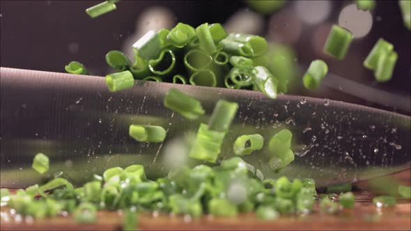 Cutting Fresh Green Onions on a Cutting Board