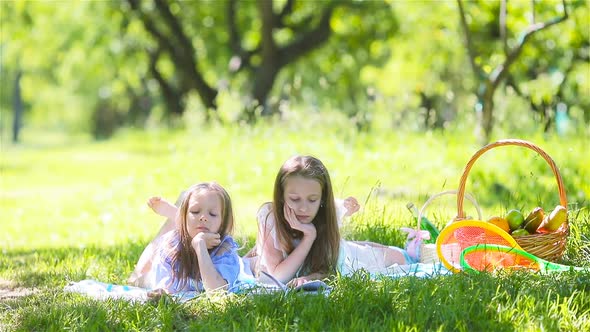 Two Little Kids on Picnic in the Park