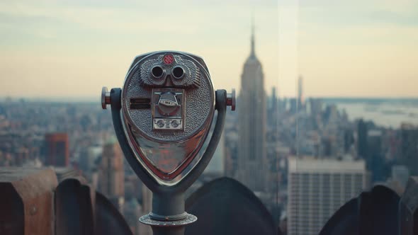 Viewing binoculars against the sky