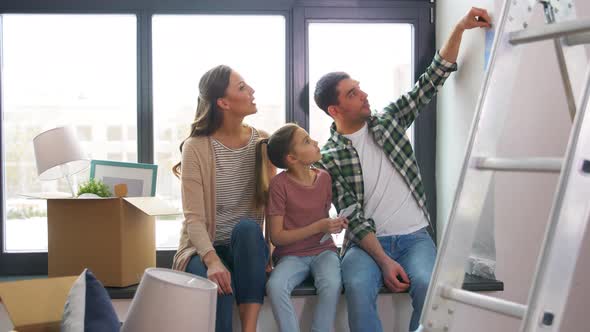 Happy Family with Color Palette Moving To New Home