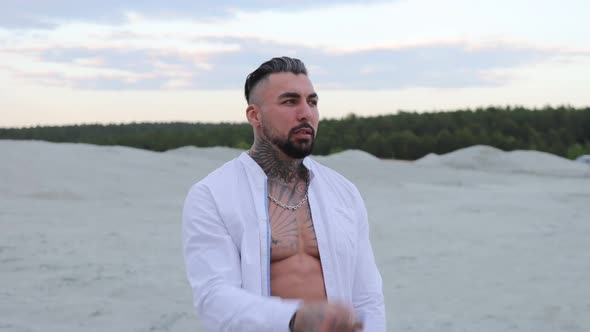 Brutal Man Walking on Beach