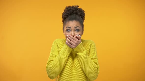 Young African-American Woman Closing Mouth With Hands, Keeping Secret, Gossip