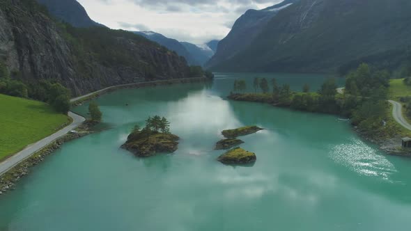 Lovatnet Lake with Turquoise Water and Green Islands. Beautiful Nature of Norway. Aerial View