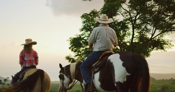 Couple Horseback Riding